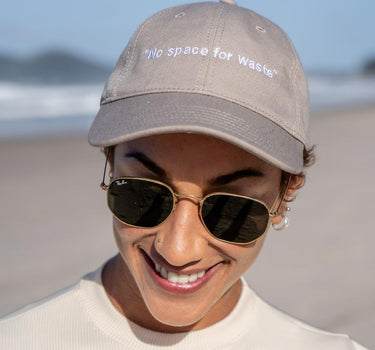 Stylish and sustainable low-profile six-panel hat with 'No Space For Waste' slogan, crafted from light-weight cotton canvas, perfect for eco-aware fashion statements.