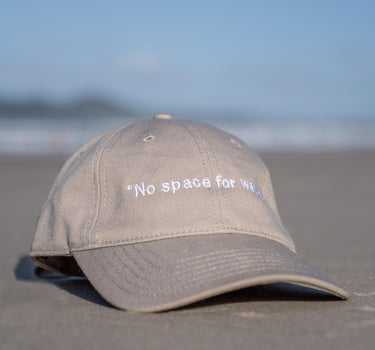 Adjustable 'No Space For Waste' cotton canvas cap with metal clasp, combining comfort, durability, and eco-conscious design in a light-weight, one-size-fits-all package.
