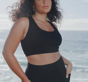 Eco-Conscious Black Tina Sports Bra with Elegant Cross-Over Strap Design, Perfect for Australian Women's Activewear.