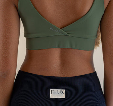Empowering Olive Green sports bra by F.lux, blending style with performance for an unmatched comfort and silhouette sculpting.