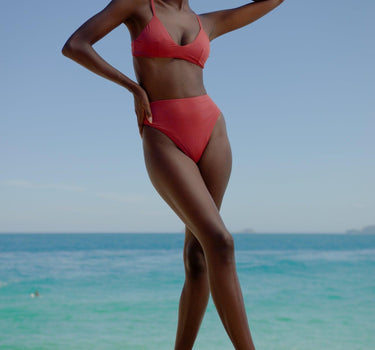 Stylish and eco-friendly Iron Ore Orange Bikini Top, designed for the fashion-forward Australian woman embracing sustainable beachwear.